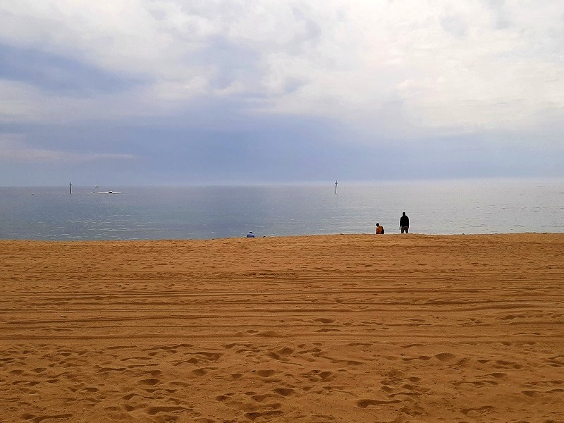 dark clouds beach barcelona stopover walk