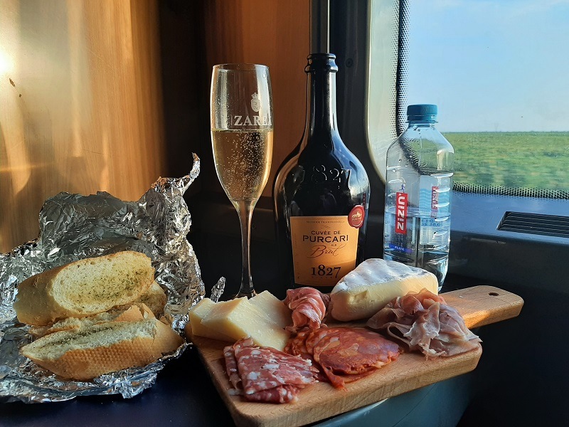 charcuterie board cheese cold cuts sparkling wine satu mare night train romania